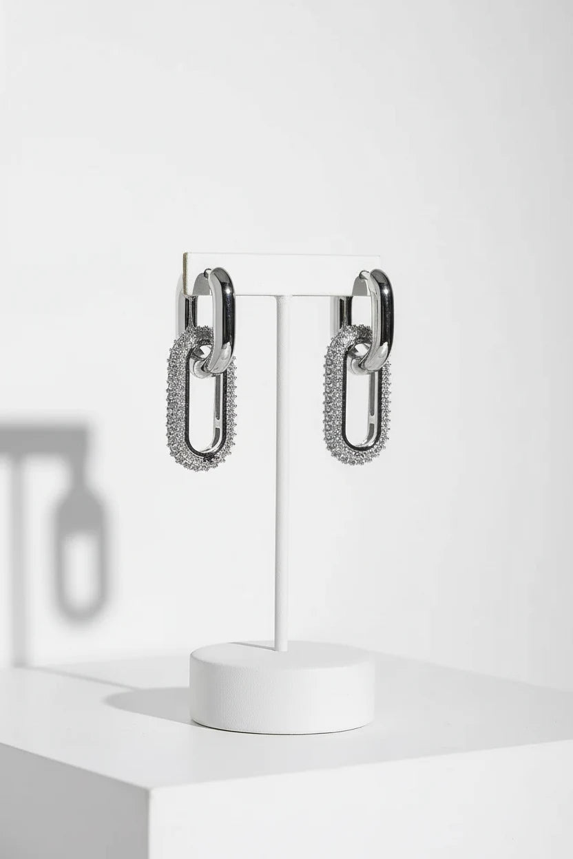 Silver Link Drop Earrings hanging on white stand, pavé paperclip link drops | OriaJewel