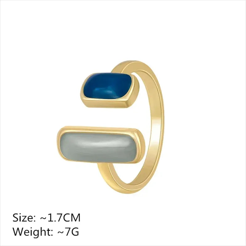 Two Stone Open Ring product close-up on a clean white background, showing the open adjustable design with two rectangular stones (ivory and deep blue) | OriaJewel