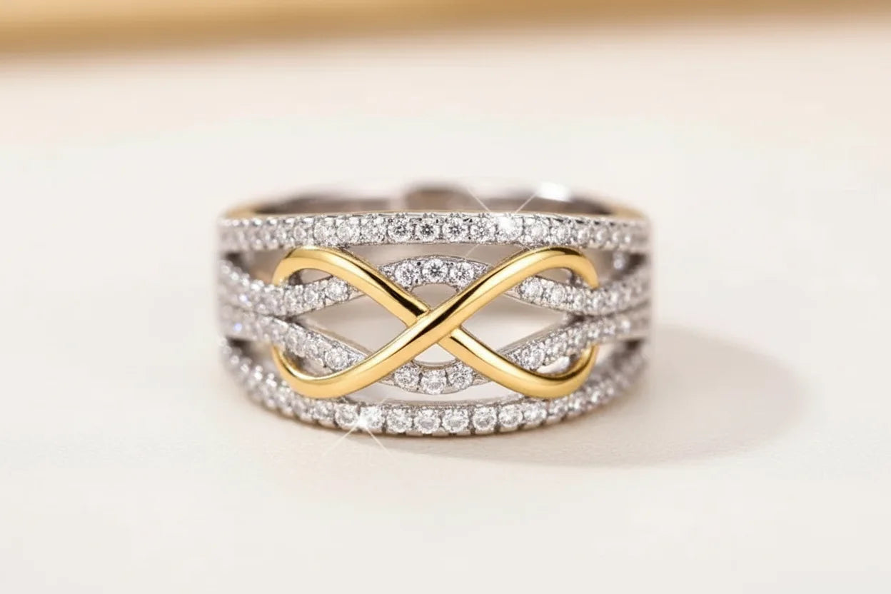 Two Tone Criss Cross Ring macro close-up on a neutral background, detailed view of the gold crossover motif framed by multiple pavé-set silver bands | OriaJewel