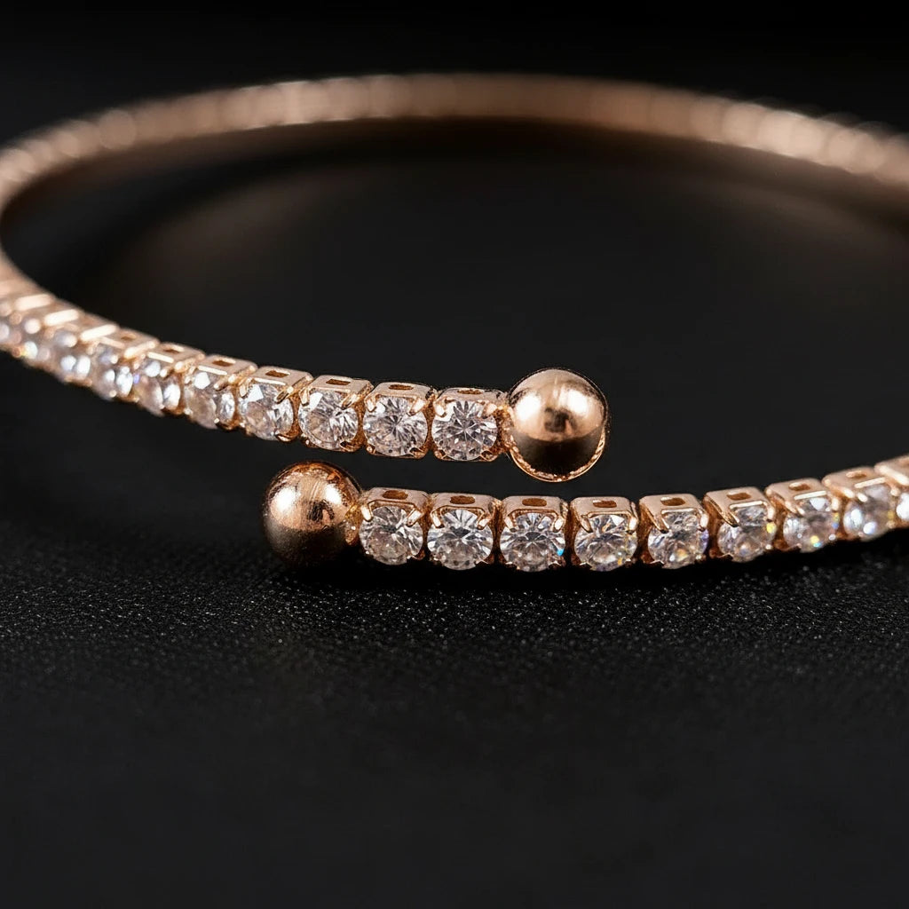 Close-up detail of Veluxa Pavé Wrap Cuff ends, round metal tips and neatly aligned pavé stones on a black background | Oria Jewel