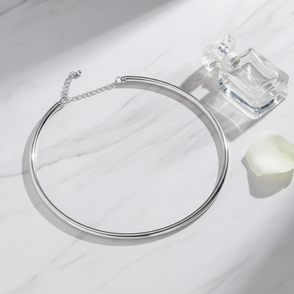 Vintage Choker Necklace in silver placed beside perfume bottle on marble background for minimalist styling | Oria Jewel