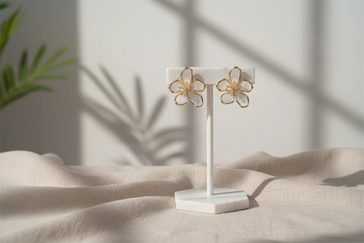 White Flower CZ Stud Earrings on a display stand with soft sunlight | OriaJewel