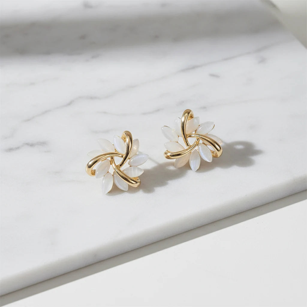 White Petal Cluster Stud Earrings close-up on marble surface | OriaJewel