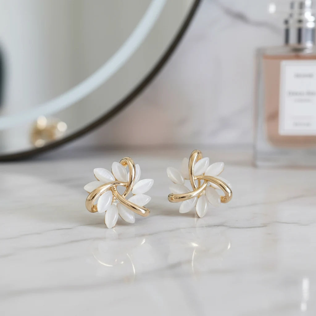 White Petal Cluster Stud Earrings on marble with mirror and perfume | OriaJewel