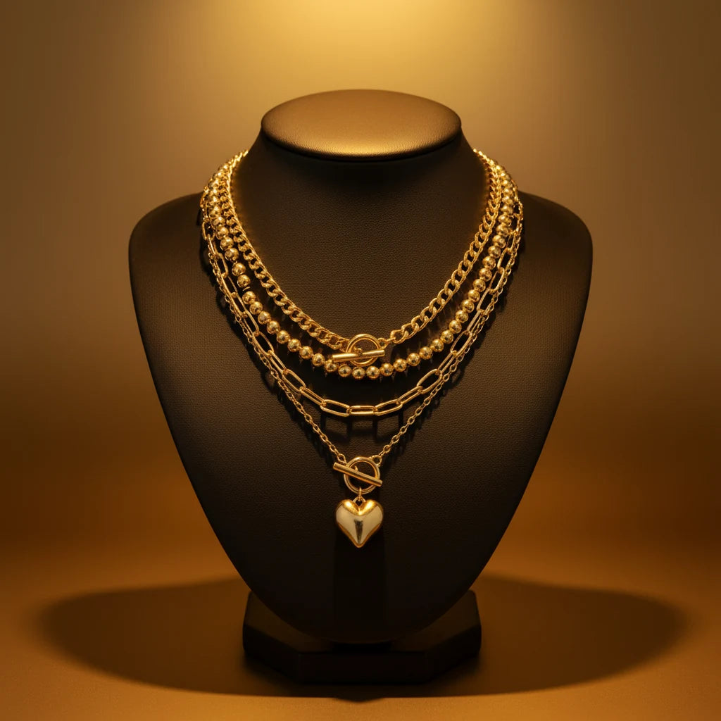 Y2K Heart Layered Necklace in gold displayed on bust under warm golden lighting highlighting heart pendant | Oria Jewel