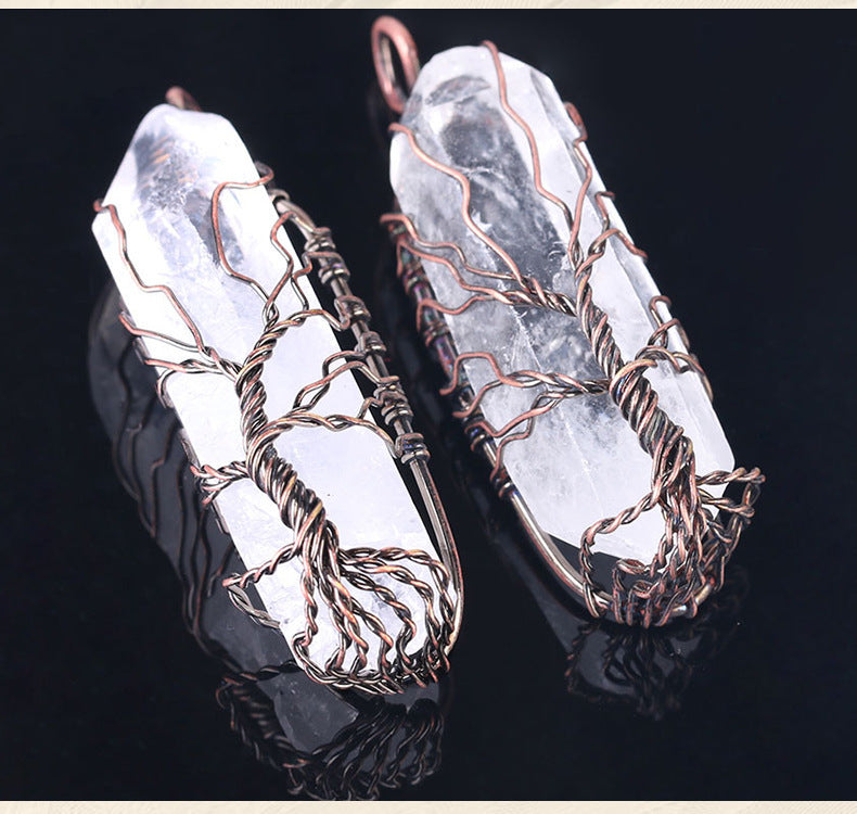 close-up of shiny crystal stone pendant reflecting light | Oria Jewel