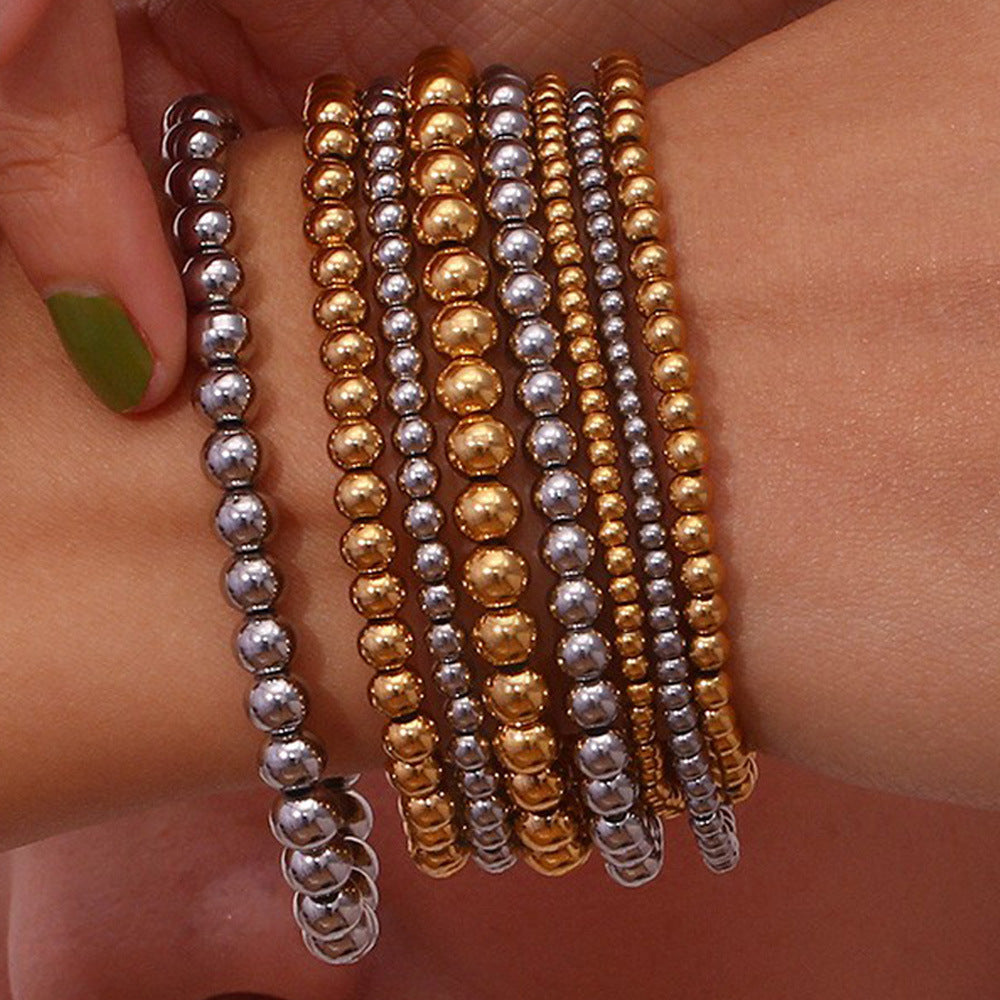 adjustable gold stretch bracelet on wrist