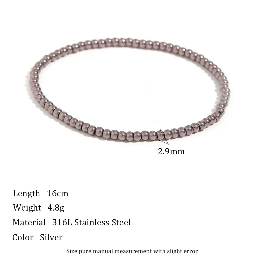 Delicate 2.9mm Silver Beaded Stretch Bracelet displayed in a perfect circle on a white background with measurements and material information, emphasizing its ultra-slim minimalist profile | Oria Jewel