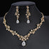 Sparkling Golden Crystal Set with floral necklace and pear-drop earrings on black | Oria Jewel
