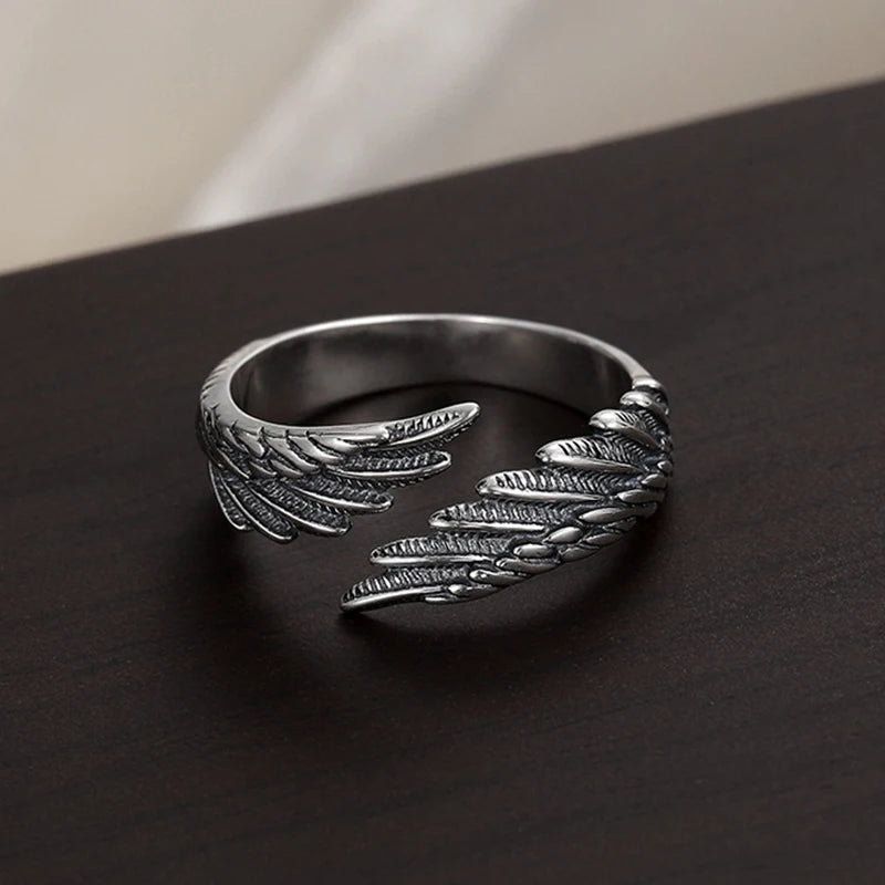 Oxidized silver Angel Bat Wrap Ring with detailed wings on dark surface | Oria Jewel