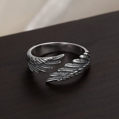 Oxidized silver Angel Bat Wrap Ring with detailed wings on dark surface | Oria Jewel