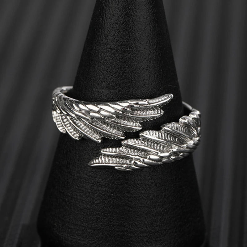 Close-up: detailed silver Angel Bat Wrap Ring displayed on a black stand | Oria Jewel