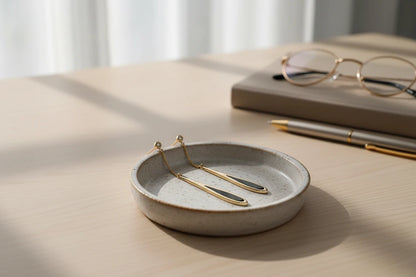 Black Teardrop Chain Drop Earrings close-up on marble background | OriaJewel