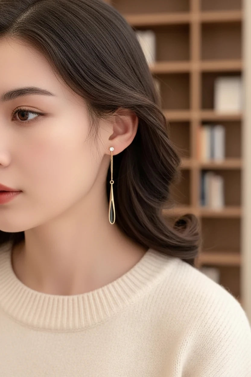 Black Teardrop Chain Drop Earrings worn with beige blazer close-up | OriaJewel