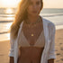Woman wearing the Boho Pendant Necklace Set on the beach at sunset — layered gold and turquoise design | Oria Jewel