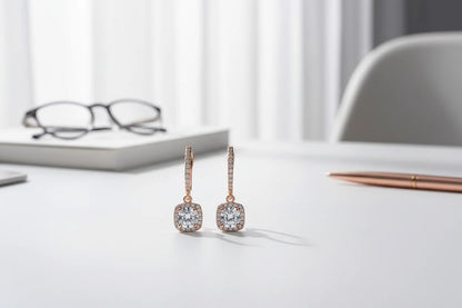 Bronze Crystal Drop Huggie Earrings on clean desk scene with glasses and pen | OriaJewel