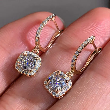 Bronze Crystal Drop Huggie Earrings in-hand close-up showing clasp and sparkle | OriaJewel