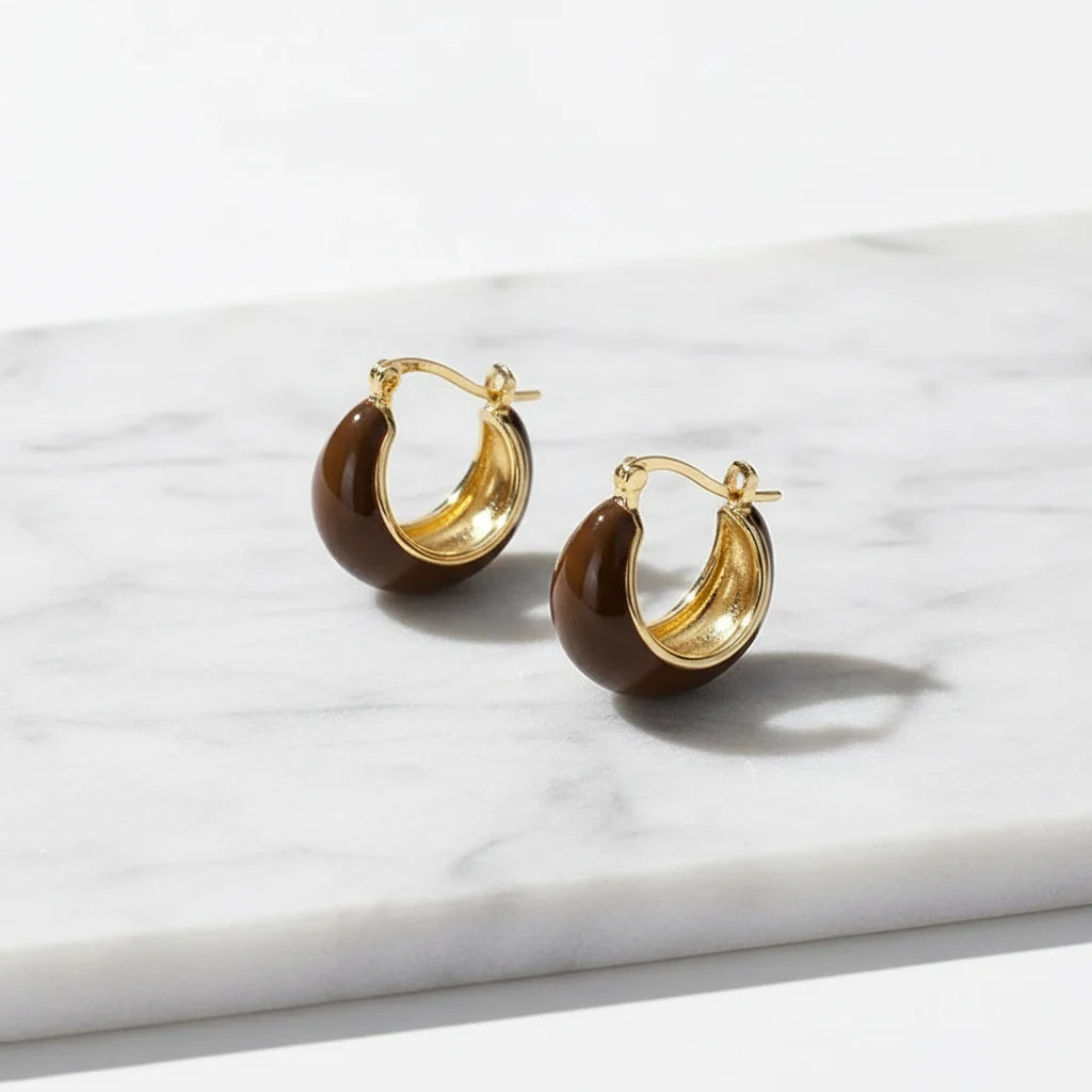 Brown Resin Huggie Hoop Earrings close-up on white marble slab | OriaJewel
