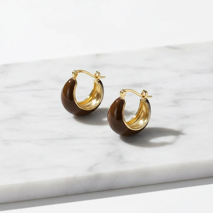 Brown Resin Huggie Hoop Earrings close-up on white marble slab | OriaJewel