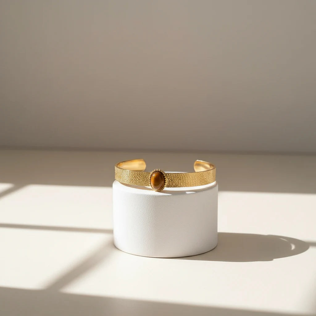 Brown gemstone cuff bracelet with textured gold band and oval brown stone center, shown on a clean white background with measurements and weight details for size reference | Oria Jewel