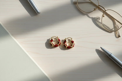 Burgundy Huggie Hoop Earrings flat lay with glasses and notebook | OriaJewel