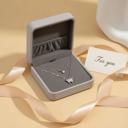 Butterfly Layered Necklace presented in a gray gift box with peach satin ribbon and a “For you” card, styled as a ready-to-give jewelry gift | Oria Jewel
