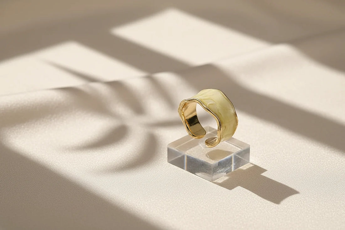 Champagne Marble Open Wave Ring on a clear acrylic stand with window-light shadows | OriaJewel