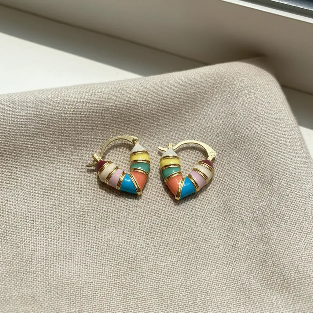 Colorful Heart Huggie Hoop Earrings on linen fabric with soft light | OriaJewel