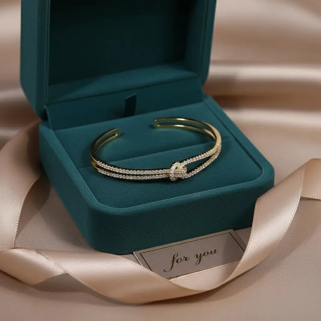 Gift-ready gold Crystal Knot Cuff Bracelet displayed in a dark green velvet jewelry box with satin ribbon and “for you” card | Oria jewel