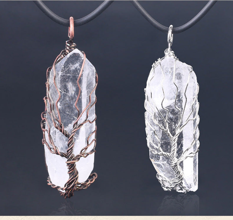 close-up of shiny crystal stone pendant reflecting light | Oria Jewel