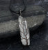 close-up of shiny crystal stone pendant reflecting light | Oria Jewel