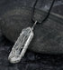 close-up of shiny crystal stone pendant reflecting light | Oria Jewel
