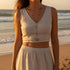 Model wearing a casual outfit featuring a Crystal Y Necklace on the beach at sunset | Oria Jewel