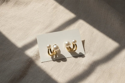 Double Pearl Huggie Hoop Earrings on card with soft fabric shadows | OriaJewel