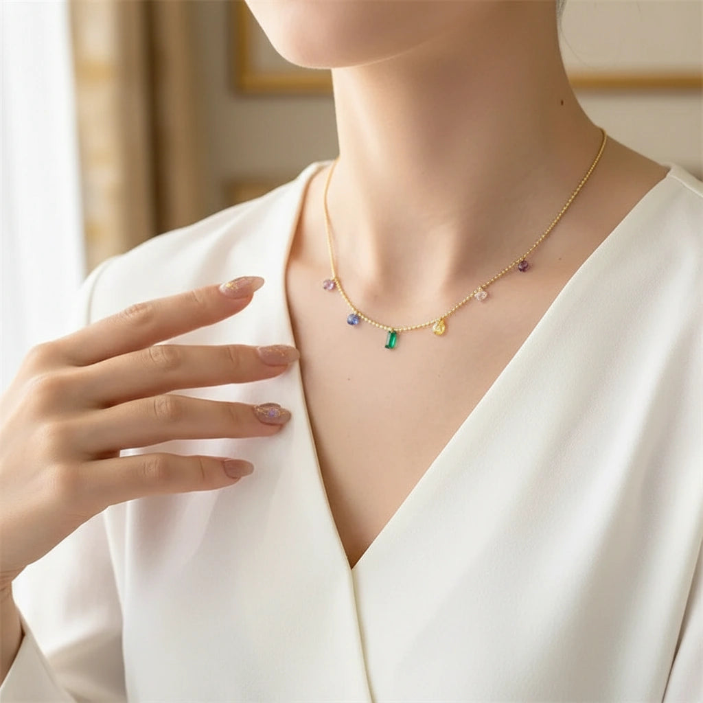Woman wearing Elegant Zircon Necklace with white V-neck blouse — refined and delicate everyday luxury look | Oria Jewel
