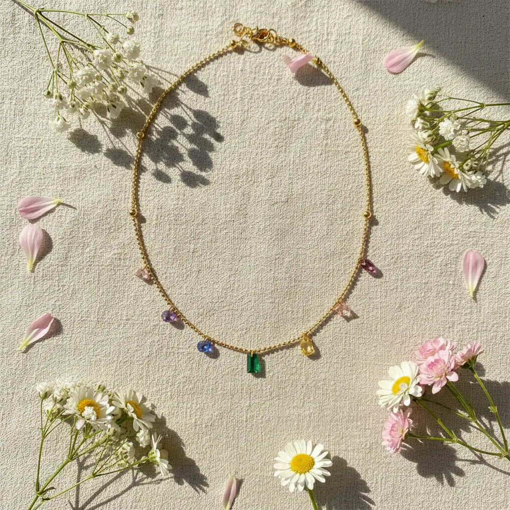 Flat-lay of Elegant Zircon Necklace surrounded by daisy flowers and petals — minimalist floral background | Oria Jewel
