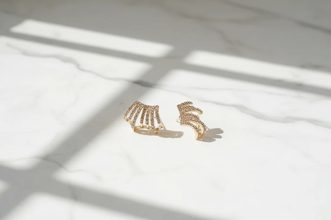 Fan Ear Cuff Earrings on marble surface with soft window shadows | OriaJewel