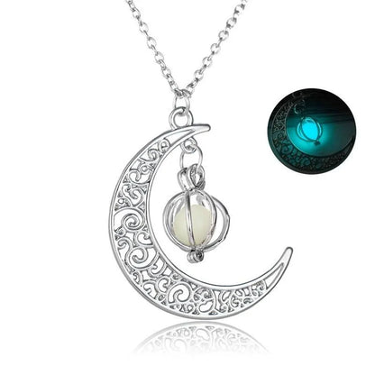 Detailed silver Glowing Moon Locket necklace with swirling crescent design and luminous orb, inset image showing teal blue night glow | Oria Jewel