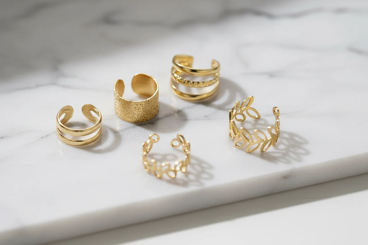 Gold 5-Piece Ear Cuff Set arranged on marble surface close-up | OriaJewel
