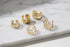 Gold 5-Piece Ear Cuff Set arranged on marble surface close-up | OriaJewel