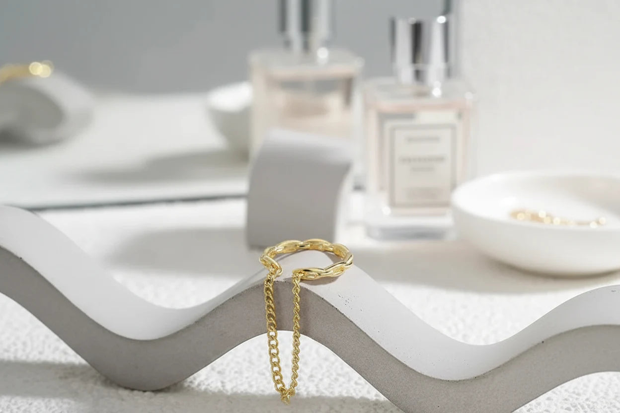 Gold Chain Ear Cuff on wave display with soft vanity background | OriaJewel