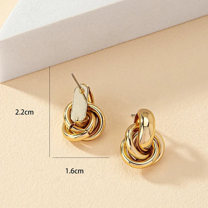 Gold Chunky Knot Stud Earrings size detail on beige background | OriaJewel