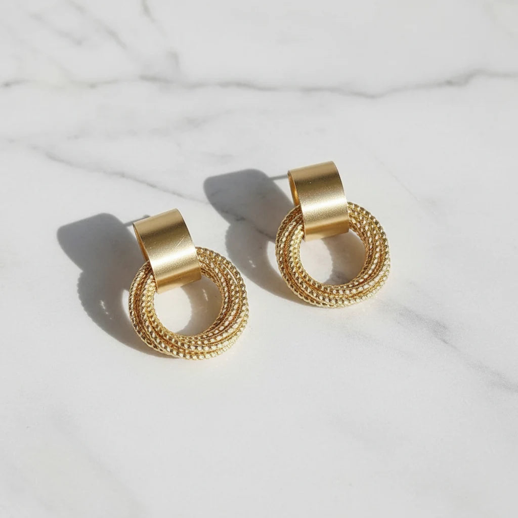 Gold Circle Drop Stud Earrings close-up pair on marble background | OriaJewel
