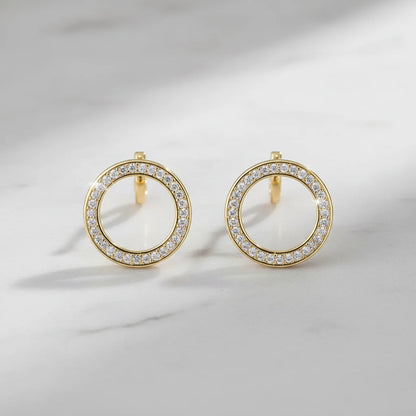 Gold Circle Stud Earrings close-up on marble background | OriaJewel