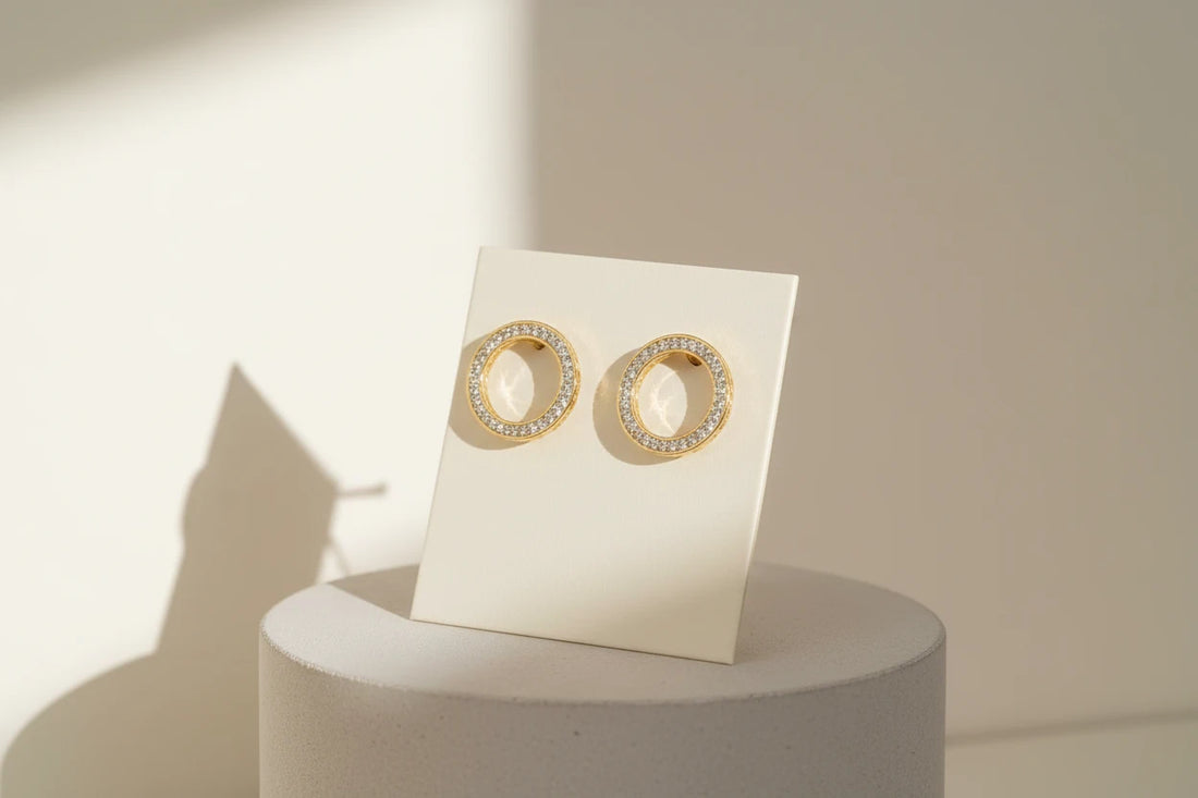 Gold Circle Stud Earrings on display card with sunlit shadows | OriaJewel