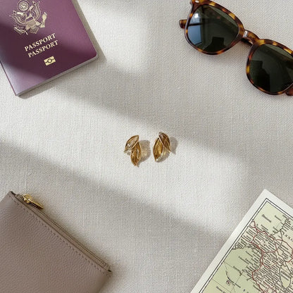 Gold Double Leaf Stud Earrings macro on linen fabric, leaf details | OriaJewel