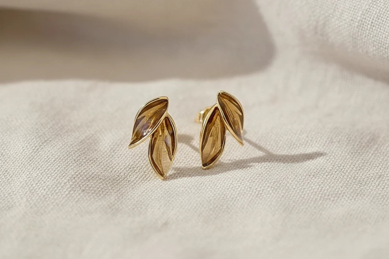 Gold Double Leaf Stud Earrings macro on linen fabric, leaf details | OriaJewel