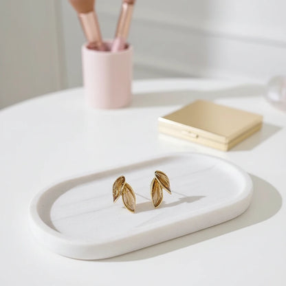 Gold Double Leaf Stud Earrings on white tray, minimal vanity flat lay | OriaJewel