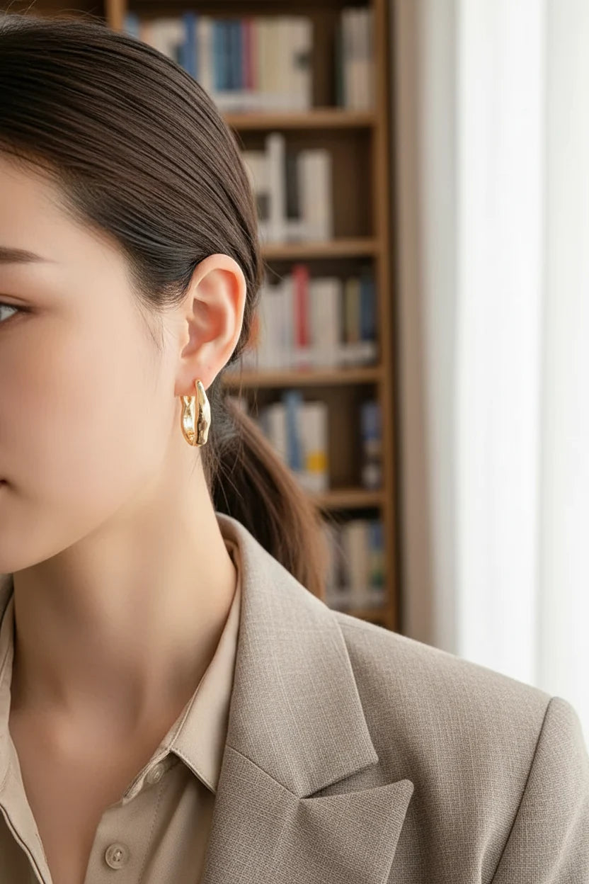 Gold Huggie Hoop Earrings worn by model close-up side view | OriaJewel