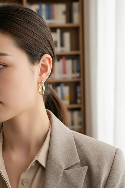 Gold Huggie Hoop Earrings worn by model close-up side view | OriaJewel